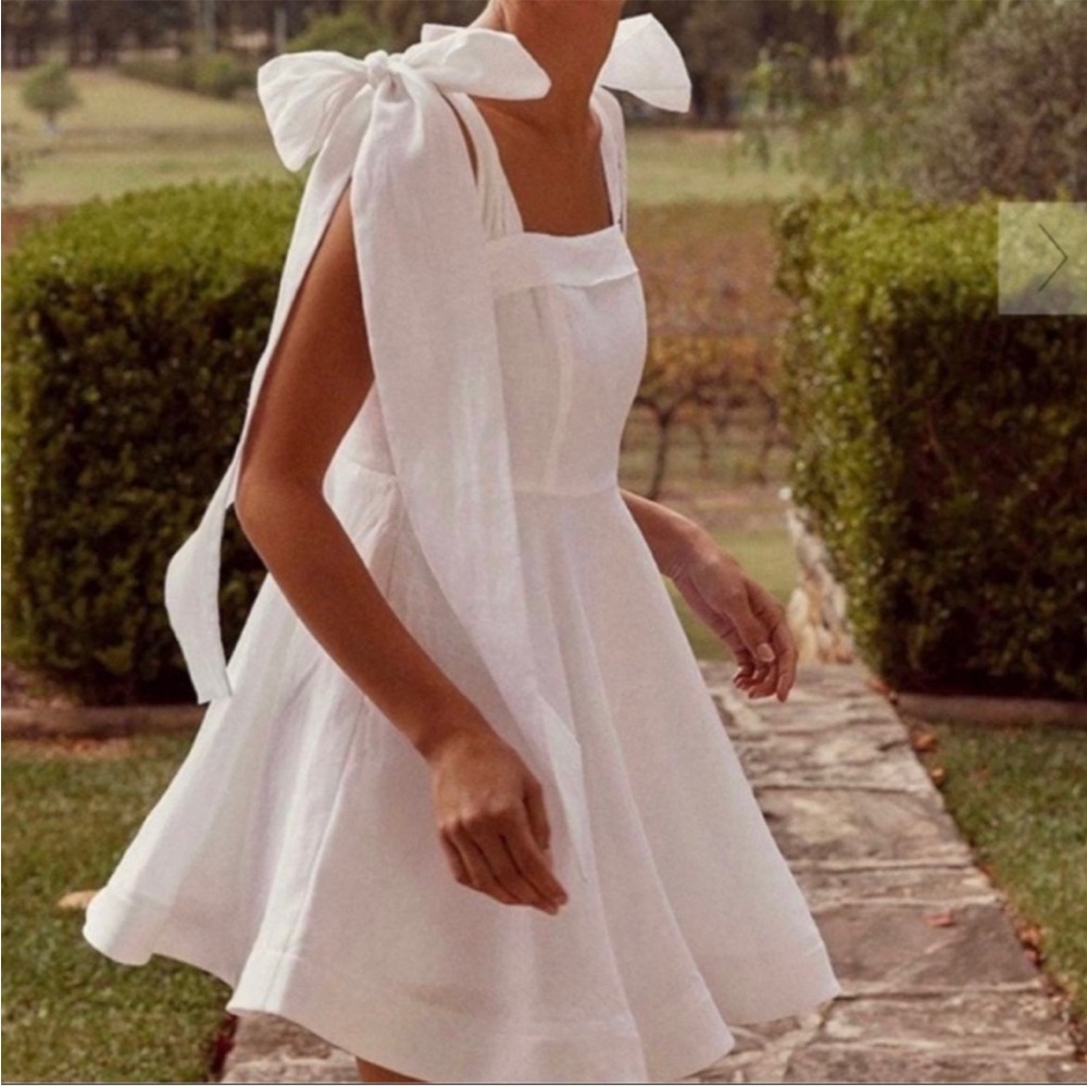 Dissh RARE Aisle White Linen Bow Mini Dress